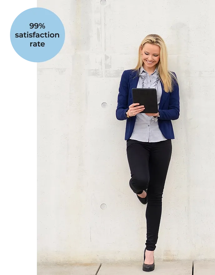 99% satisfaction rate - woman leanin on wall, smiling down at her tablet