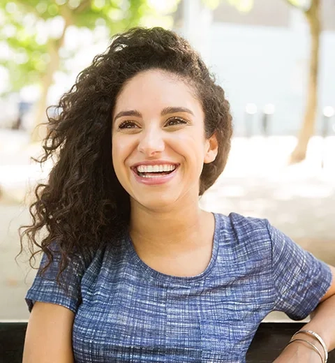 image of woman smiling in a park
